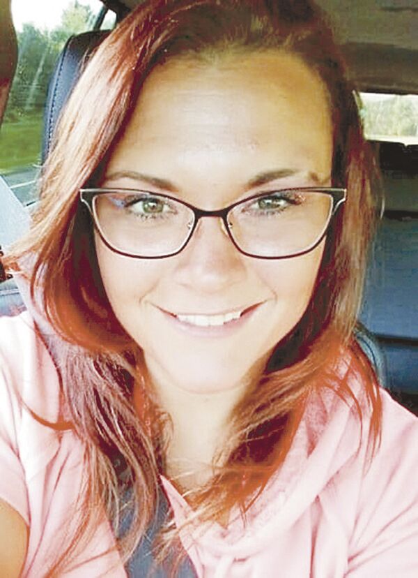 Ashley Carlson, with glasses